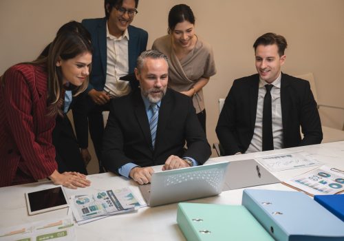 Business people, laptop and clapping hands in meeting for proposal, logo or reveal in office. Team, applause and corporate success by group celebrating achievement, project and job well done together